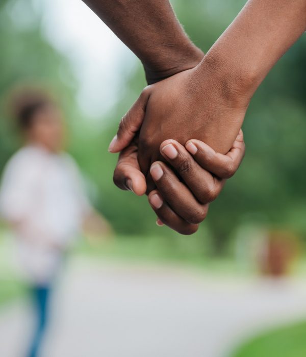 cropped shot of african american couple holding hands